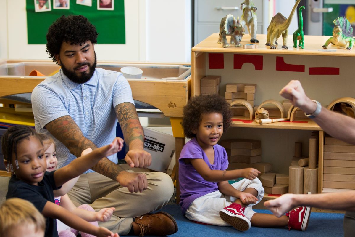 Teacher in classroom with children